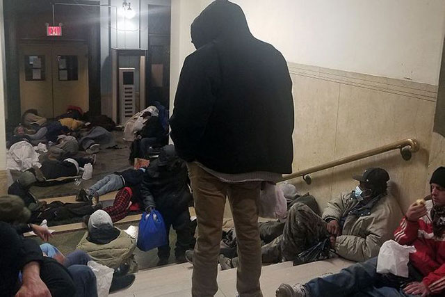Homeless men jammed into entrance of NYC's 30th Street
shelter, May 2020. (Photo obtained by The City)