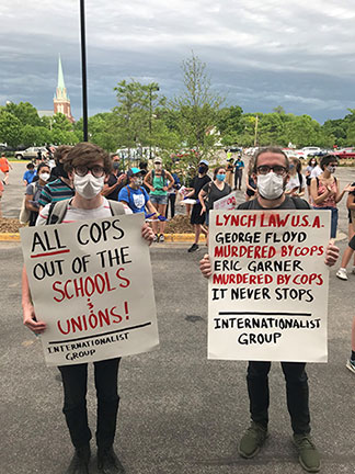 Internationalist Group supporters at June 2
                demonstration for police out of the Minneapolis schools.
                (Internationalist photo)