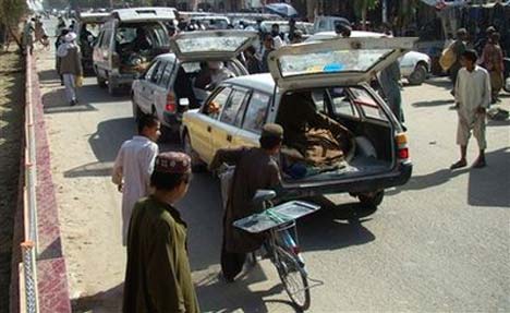 cars bring bodies of villagers killed by u.s. airstrike in helmand province to place in front of governor's house, november 5. (photo: abdul khaleq/ap)