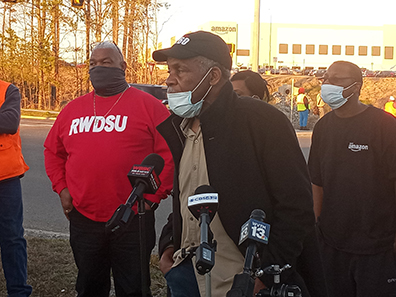 Danny Glover and Mike Foster at press conference in
                support of Amazon union drive