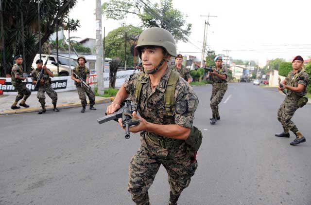 Elite troops surround the home of Honduran president Manuel Zelaya on the morning of June 28.