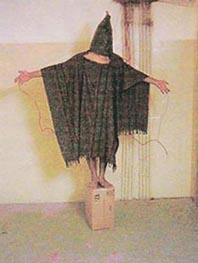 Iraqi prisoner being tortured at Abu Ghraib