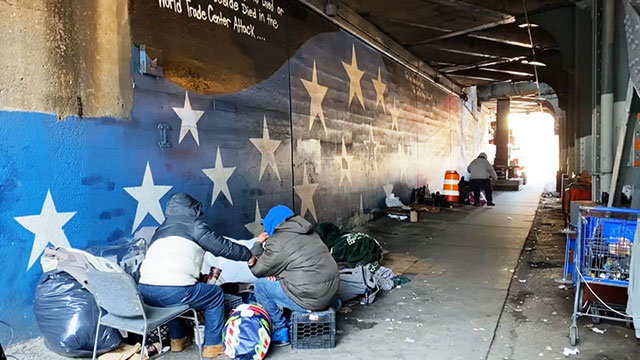 Homeless in NYC on New Year's Day 2020, under overpass
            in Woodside, Queens. (Photo: NY1)