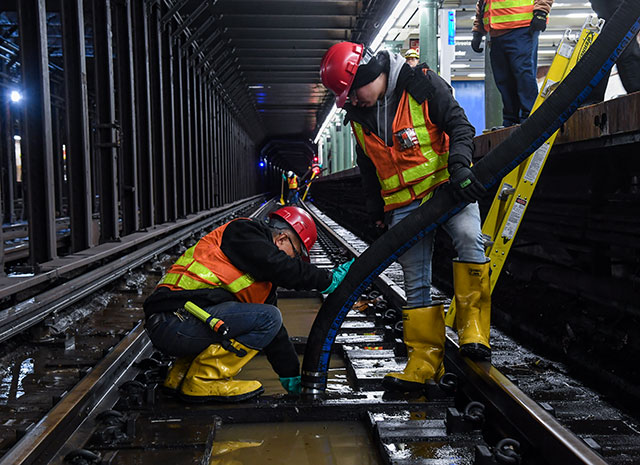 NYC subway workers restoring service after water
                mainbreak, 13 January 2020. (Photo: MTA)