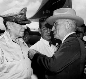 u.s. president truman decorates gen. macarthur in ceremony on wake island, october 1950. in the background is u.s. ambassador to south korea john muccio, who received a medal of merit. macarthur planned to wipe out north korea with atom bombs. muccio sent letter saying it was official policy to fire on refugees.