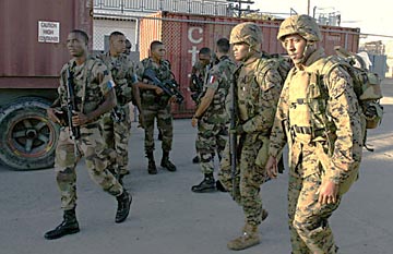 U.S. and French soldiers arrive in Haiti, March 1.
