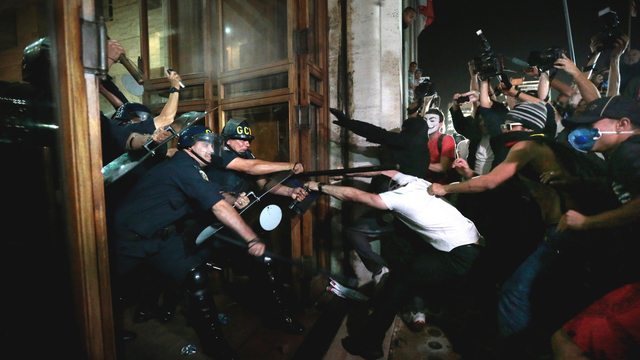Police strike at protesters at the doors of São Paulo
city hall, 18 June.