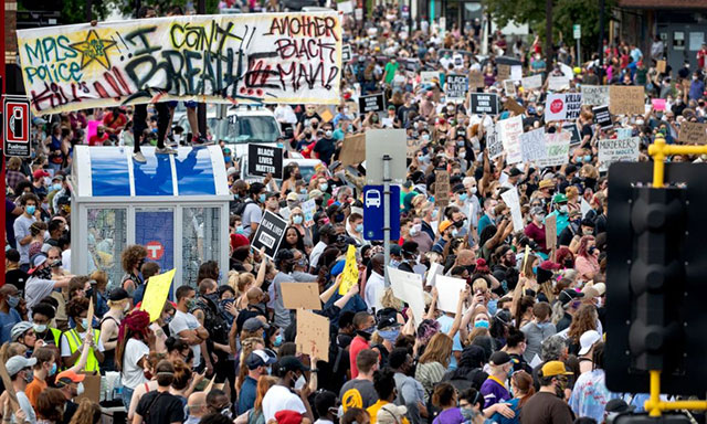 Minneapolis, 26 May 2020: Thousands protest police
            killing of Floyd George. (Photo: Carlos Gonzalez / Star
            Tribune)